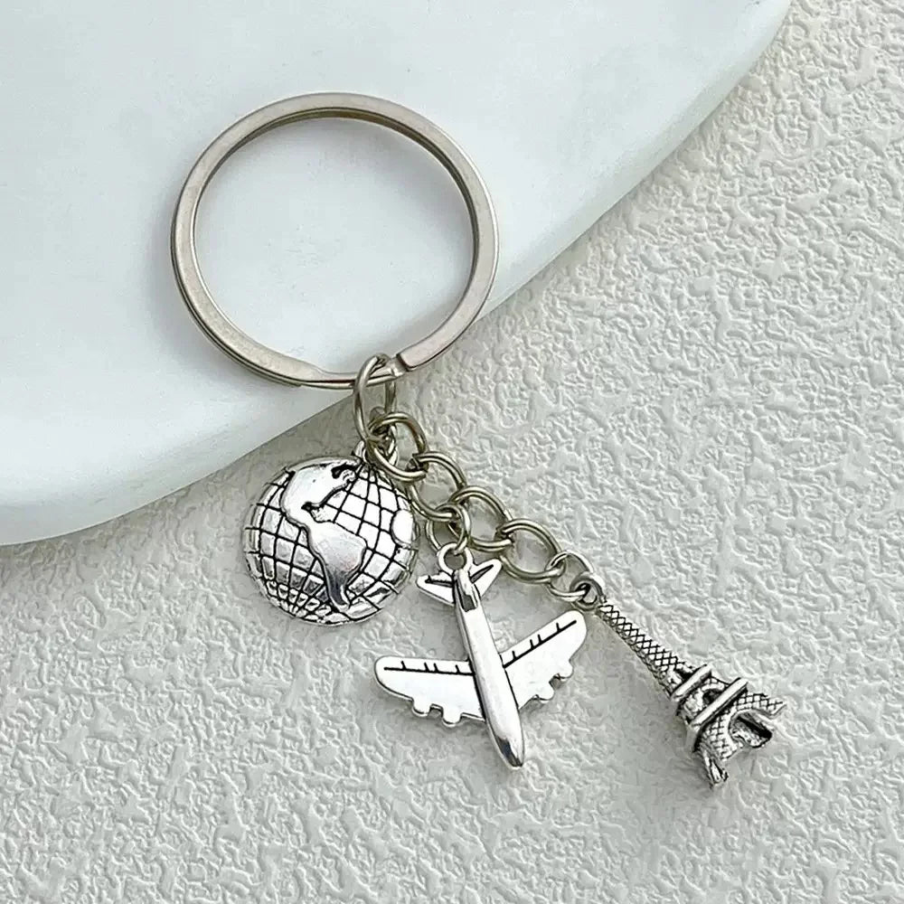 Elevate Your Style with the Luxe Tassel Chain Globe Iron Tower Airplane Keychain - Perfect for Bags & Backpacks!