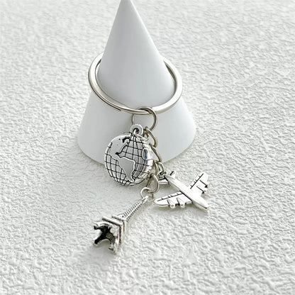 Elevate Your Style with the Luxe Tassel Chain Globe Iron Tower Airplane Keychain - Perfect for Bags & Backpacks!