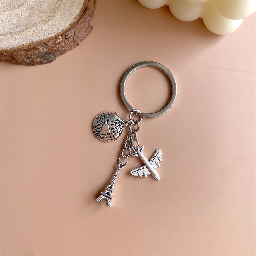 Elevate Your Style with the Luxe Tassel Chain Globe Iron Tower Airplane Keychain - Perfect for Bags & Backpacks!